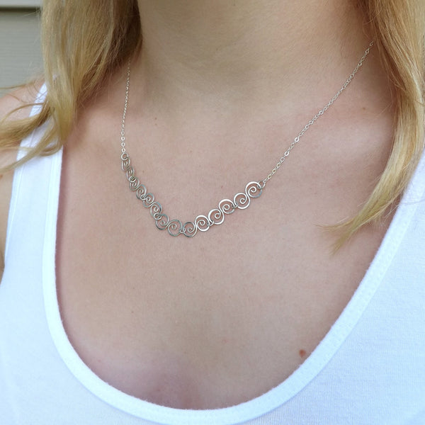 tiny swirl necklace